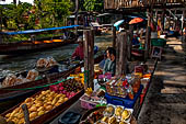 Thailand, Locals sell fruits, food and products at Damnoen Saduak floating market near Bangkok 